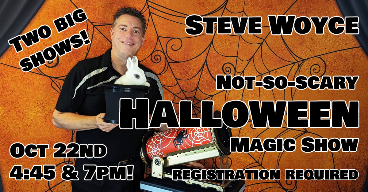 Steve Woyce holding a rabbit, promoting a Halloween magic show